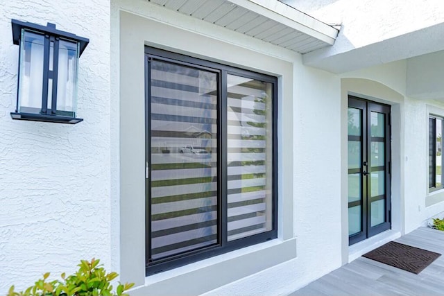 doorway to property with stucco siding