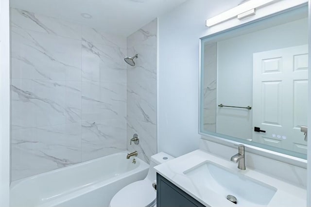 full bathroom featuring bathtub / shower combination, vanity, and toilet