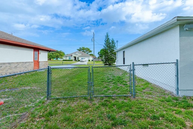 view of yard with a gate and fence