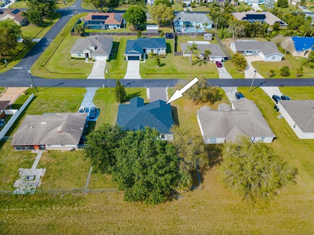 birds eye view of property with a residential view