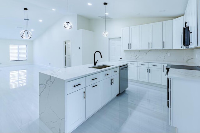 kitchen featuring light stone counters, a sink, vaulted ceiling, dishwasher, and a center island with sink