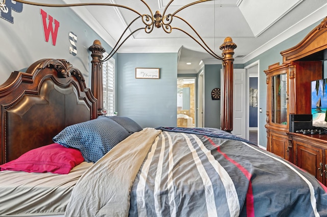 bedroom featuring ensuite bathroom and crown molding