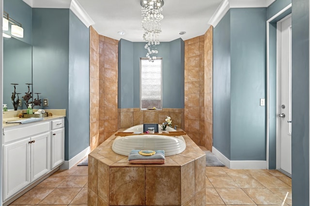 full bath featuring tile patterned floors, vanity, baseboards, and a bath