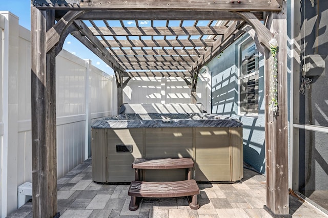 view of patio / terrace with fence private yard and a hot tub