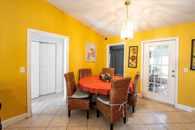 dining area with light tile patterned floors and baseboards