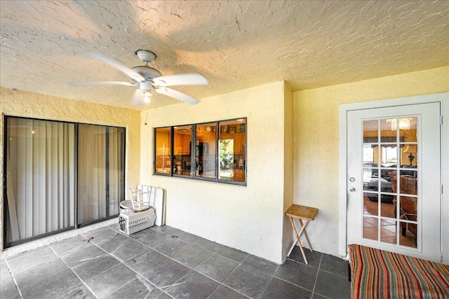 view of patio with ceiling fan