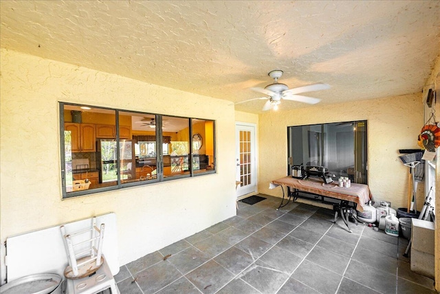 view of patio featuring ceiling fan