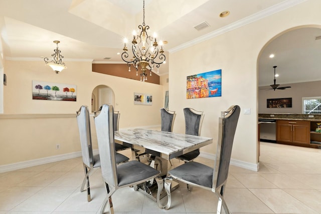 dining room with arched walkways, crown molding, light tile patterned floors, visible vents, and ceiling fan with notable chandelier