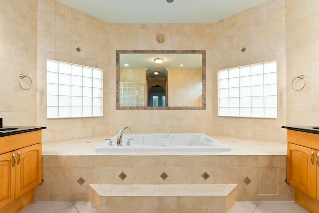 bathroom featuring a bath, tile walls, and tile patterned flooring