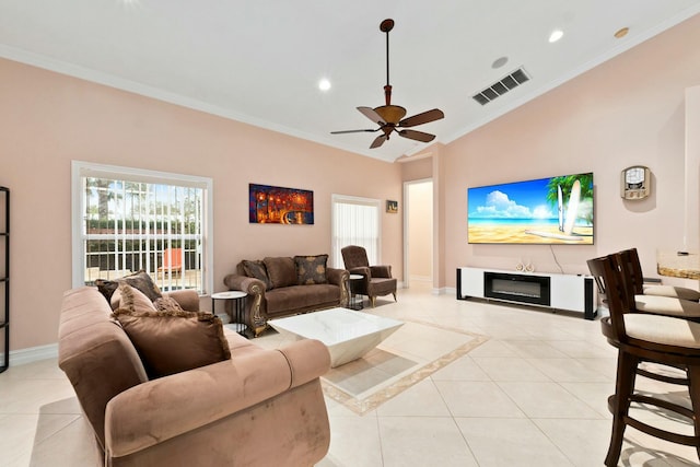 living area featuring ceiling fan, baseboards, visible vents, and light tile patterned floors