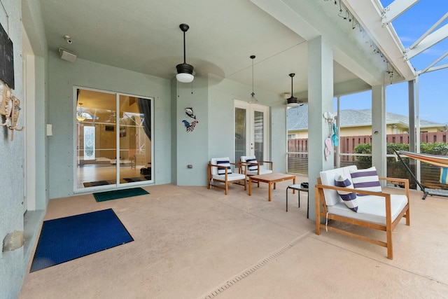 view of patio featuring fence, a ceiling fan, and french doors