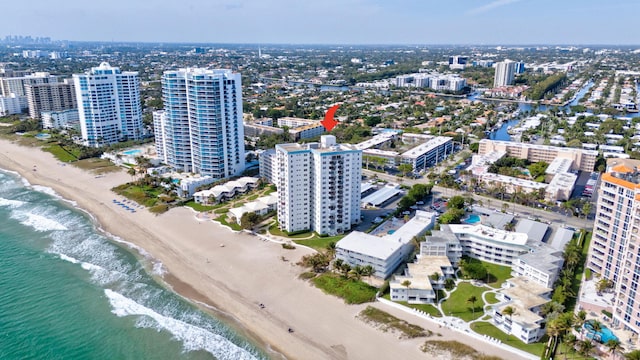 bird's eye view featuring a beach view, a water view, and a city view