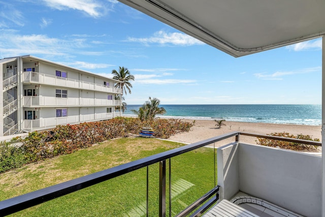 balcony with a view of the beach and a water view