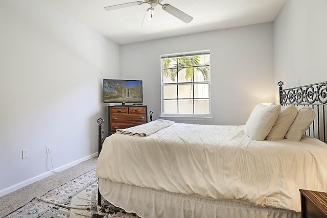 bedroom with carpet, baseboards, and a ceiling fan