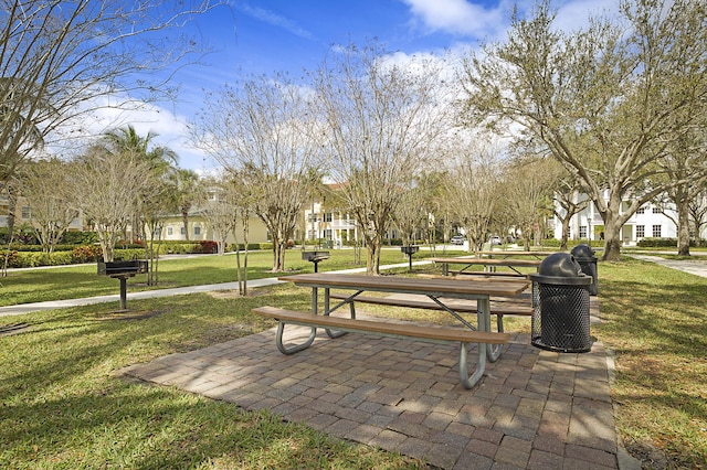 view of home's community with a yard