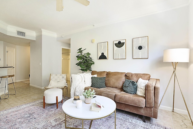 living room with visible vents, ornamental molding, ceiling fan, tile patterned flooring, and baseboards