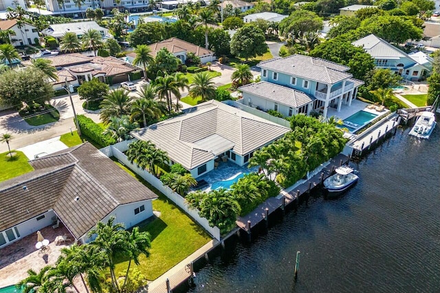 drone / aerial view featuring a water view and a residential view