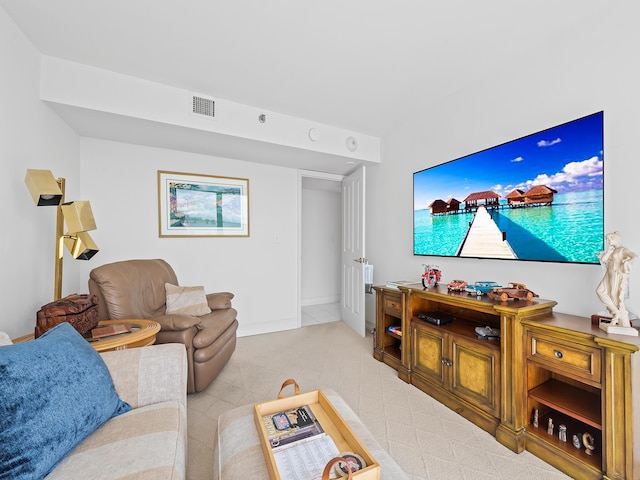 living area featuring visible vents and baseboards