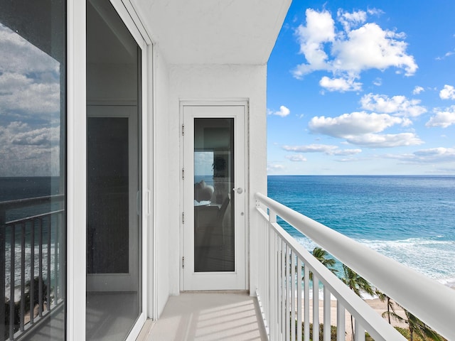 balcony featuring a water view