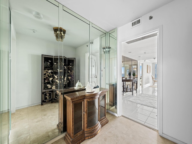 interior space featuring baseboards and visible vents