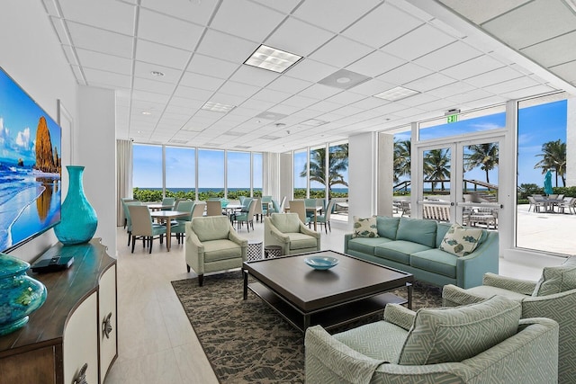 sunroom / solarium featuring a paneled ceiling