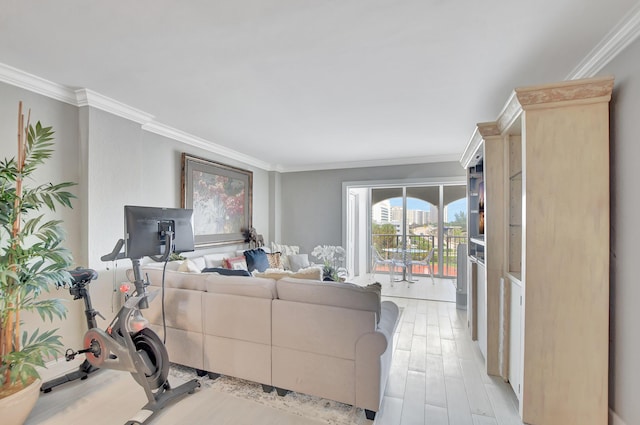 living room featuring light wood-style floors and crown molding