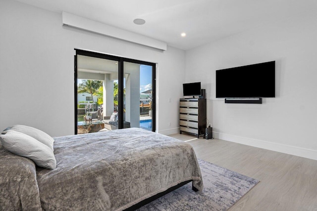 bedroom with access to outside, baseboards, wood finished floors, and recessed lighting