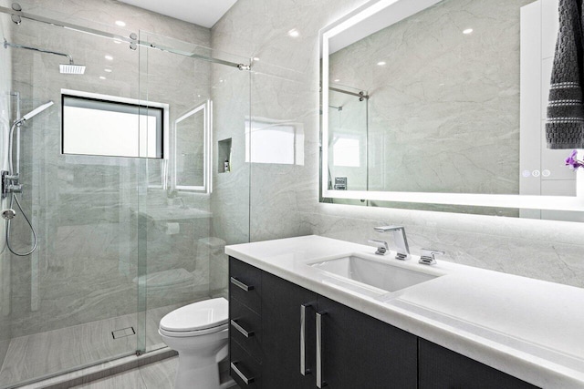 full bathroom with toilet, visible vents, vanity, tile walls, and a shower stall