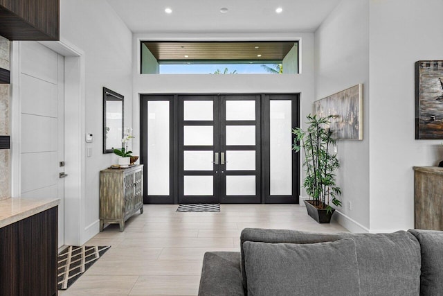 entrance foyer featuring recessed lighting, baseboards, and french doors