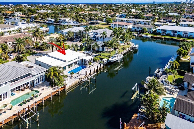 birds eye view of property with a water view and a residential view