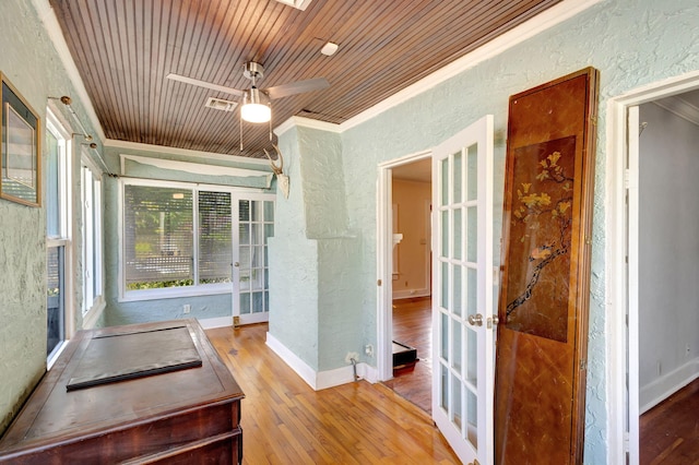 interior space featuring ceiling fan, french doors, and wood ceiling