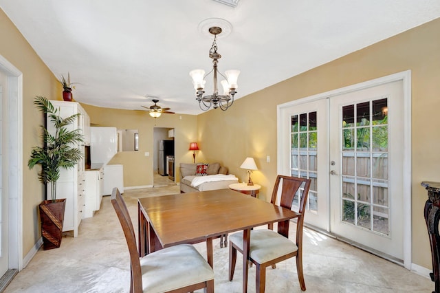 dining space featuring baseboards, a notable chandelier, and french doors