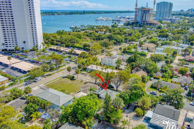 aerial view featuring a view of city and a water view