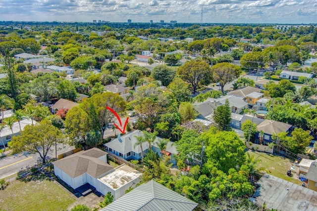 birds eye view of property with a residential view