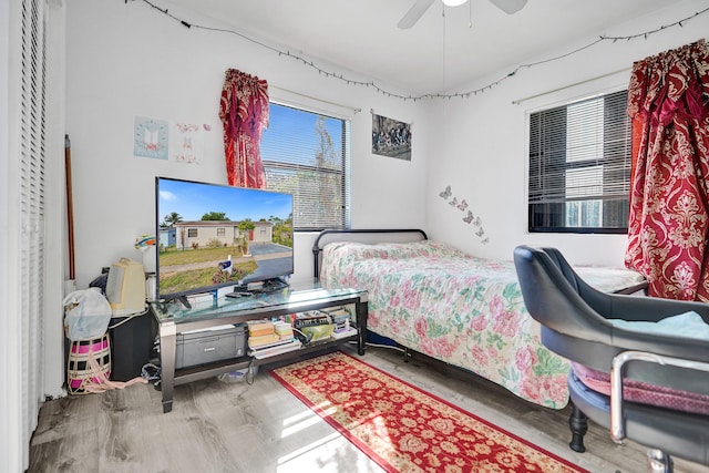 bedroom featuring a ceiling fan and wood finished floors