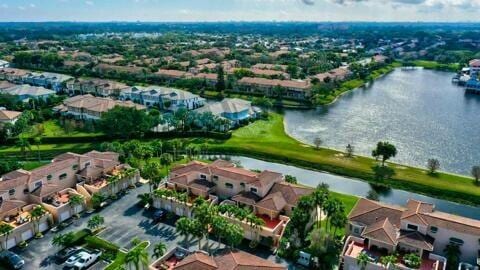 bird's eye view with a water view and a residential view