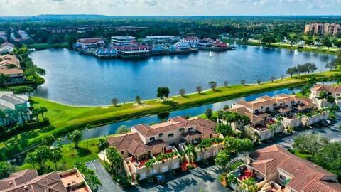 bird's eye view featuring a water view and a residential view