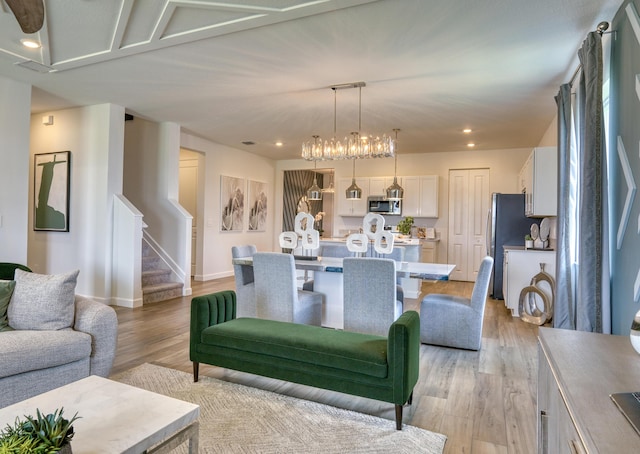 dining area featuring stairs, light wood-type flooring, baseboards, and recessed lighting