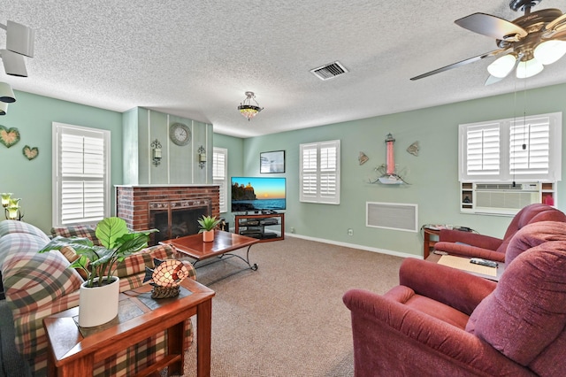 living area featuring carpet floors, cooling unit, visible vents, and a fireplace