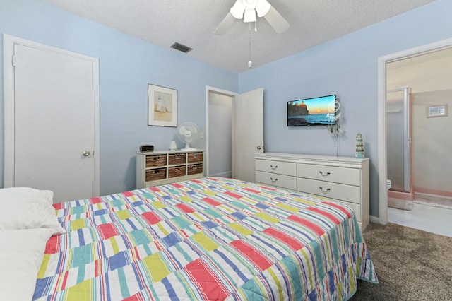 carpeted bedroom featuring visible vents, ceiling fan, and a textured ceiling