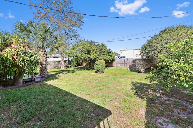 view of yard with a fenced backyard