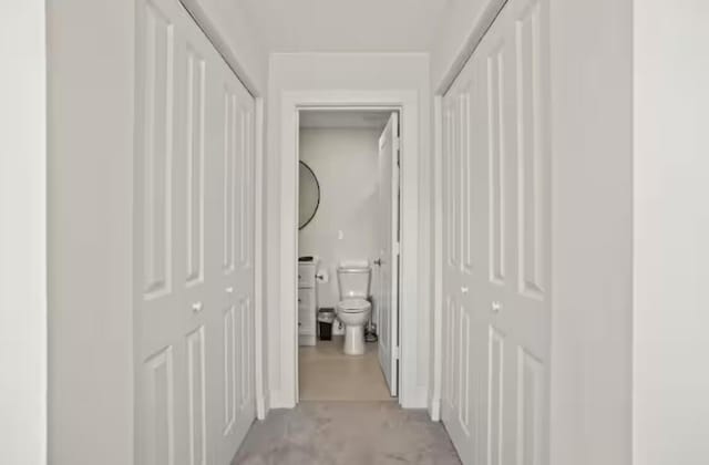 corridor featuring concrete flooring