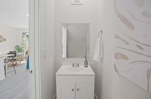 bathroom with visible vents and vanity