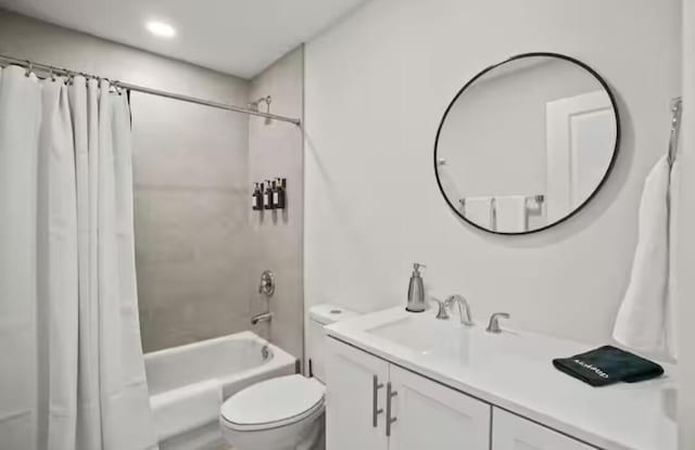 bathroom featuring toilet, shower / bathtub combination with curtain, and vanity