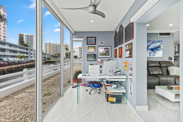 office space with floor to ceiling windows, recessed lighting, visible vents, ceiling fan, and baseboards