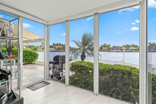 sunroom with a water view