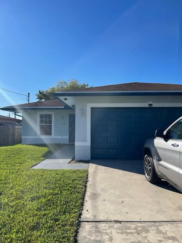 single story home with stucco siding, concrete driveway, fence, a garage, and a front lawn