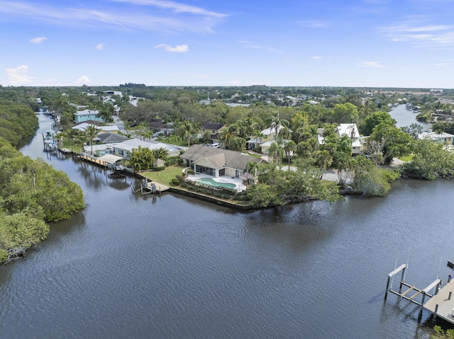 birds eye view of property with a water view and a residential view