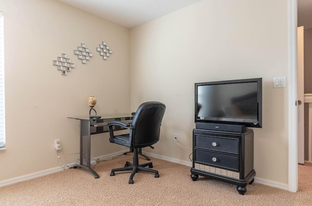 office space with light carpet and baseboards