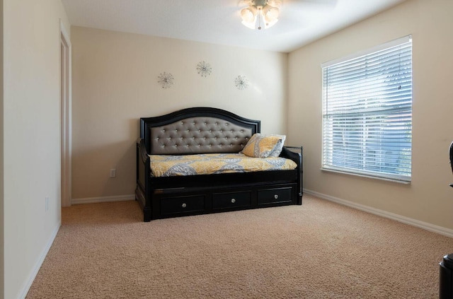 bedroom featuring carpet floors and baseboards